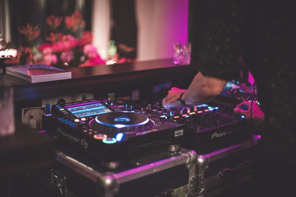 dj equipment with dj hand playing