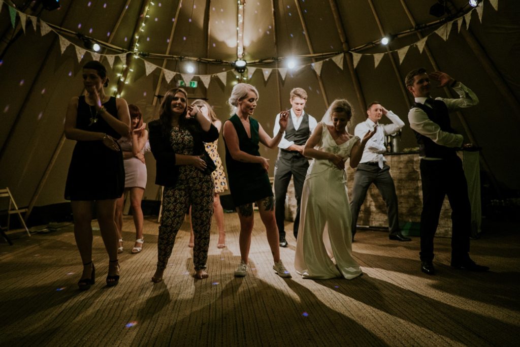 wedding guests dancing on the dance floor